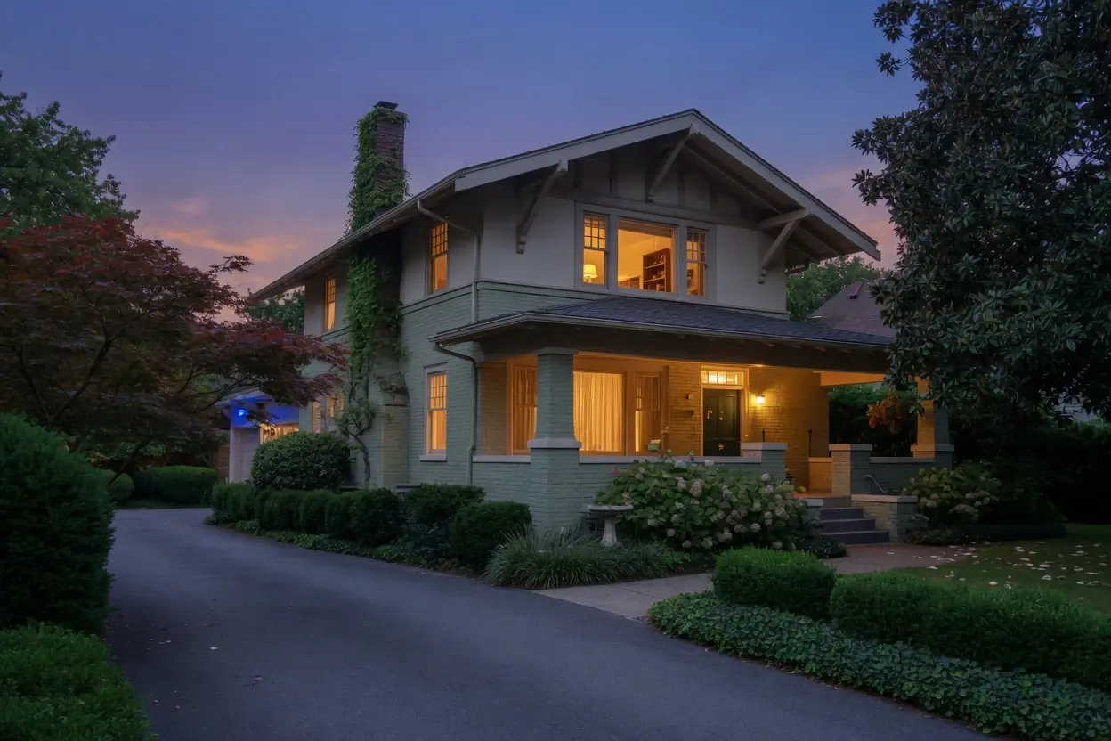 A home at dusk with the lights on